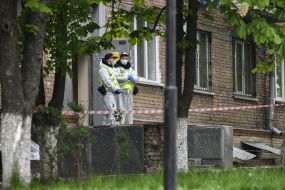 Law enforcement officers near the hostel