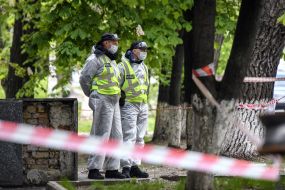 Law enforcement officers near the hostel