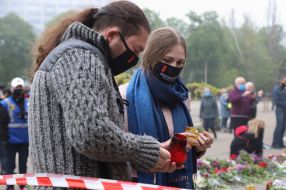People light lamps near the Trade Unions House