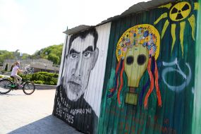 Portrait of poet Vasyl Stus at a fence in Kiev