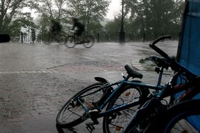Bicycles hidden from the rain under the canopy