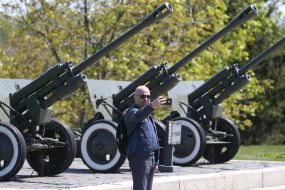 Man taking a selfie on the territory of the National Museum of History of Ukraine in the Second World War