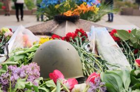 Laying flowers to the Eternal Flame
