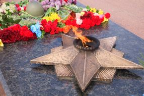 Laying flowers to the Eternal Flame