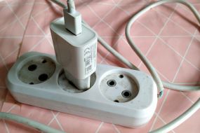 The charger is plugged into an extension cord