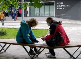 People in protective masks near the Center for Social Services