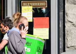The inscription "Open" on the door of one of the shops