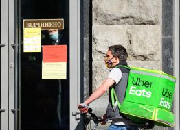 The inscription "Open" on the door of one of the shops