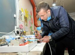 An employee of the enterprise collects electronic equipment