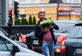 Women on bicycles and passers-by on the street