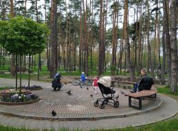 People rest in the park in the city of Irpin