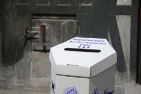 Container with used masks and gloves