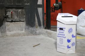 Container with used masks and gloves