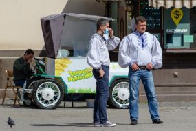 Men in embroidered shirts