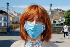 Girl in an embroidered shirt and embroidered protective mask