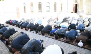 Muslims during a solemn prayer on the occasion of Ramadan Bairam