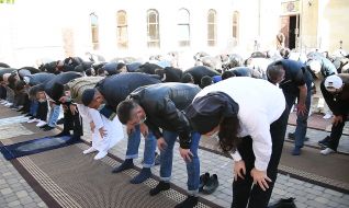 Muslims during a solemn prayer on the occasion of Ramadan Bairam