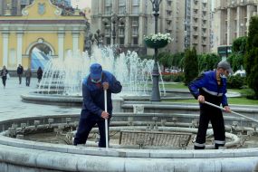 Utility workers are preparing a light and music fountain to run in test mode