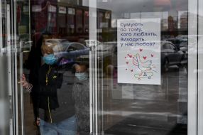 Poster with the inscription "Miss the one they love" on the door at shopping center in Kyiv
