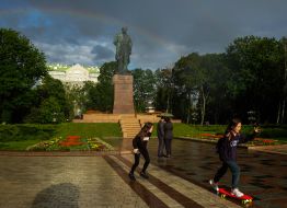 Teenagers skate in Shevchenko Park after the rain