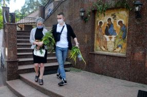 Man and woman with bouquets of sedge