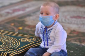A boy in a medical mask