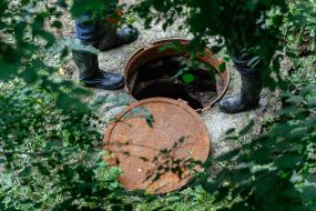 Housing and plumbing are near the open hatch