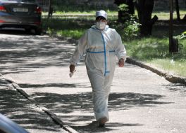 Doctor in a medical mask and protective suit