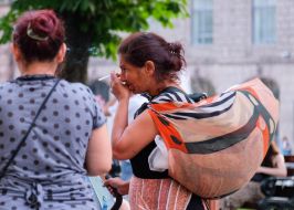 Roma woman with a cigarette in her hands