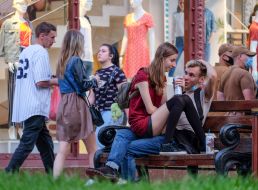 Young people resting on a bench