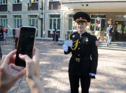 Graduate with QR-coded certificate