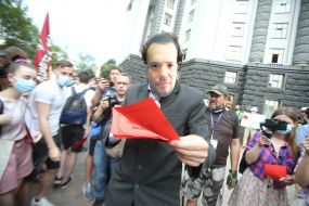 Participant of the action "StopCharlet" in a mask with the image of the Acting Minister of Education and Science Serhiy Shkarlet