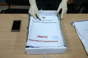 Package labeled "Warning! Do not open"