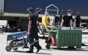 Unloading the aircraft with humanitarian aid from Italy for the flood-affected regions of Ukraine in Lviv