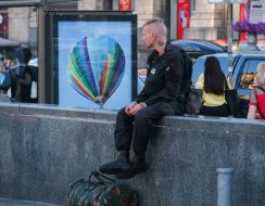 A man is resting on the street in Kiev