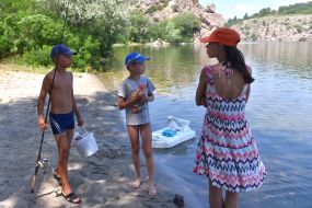 Children rest by the river in Zaporozhye
