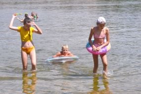 Children rest by the river in Zaporozhye