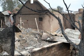 Burnt remains of a house in the village of Smolyaninovo in Luhansk region