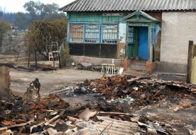 Burnt remains of a house in the village of Smolyaninovo in Luhansk region