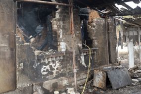 Burnt remains of a house in the village of Smolyaninovo in Luhansk region