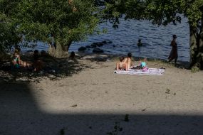 People rest on the beach
