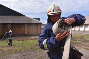Rescuers extinguish a simulated fire