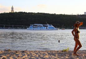 People relax on the beach