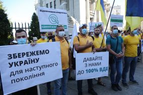 Protesters hold posters