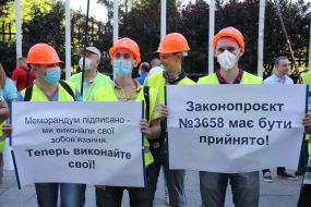 Protesters hold posters