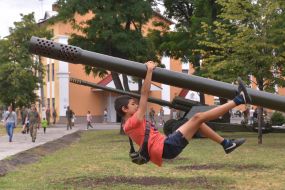 The guy near the military equipment