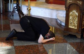 The parishioner bows in St. Michael's Cathedral