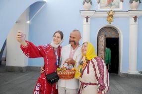 People are photographed against the background of St. Michael's Cathedral