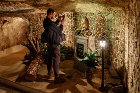 A tourist photographs a monument to Istvan Dobo