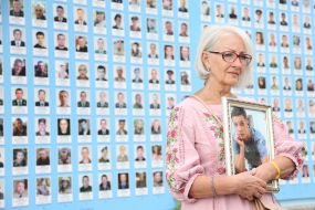 People honored the memory of the fallen soldiers near the Wall of Remembrance